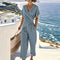 Completo da donna elegante in due pezzi: top avvolgente e pantaloni sartoriali per eventi estivi 1